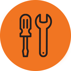 wrench and screwdriver on orange background