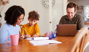 parents and child doing homework