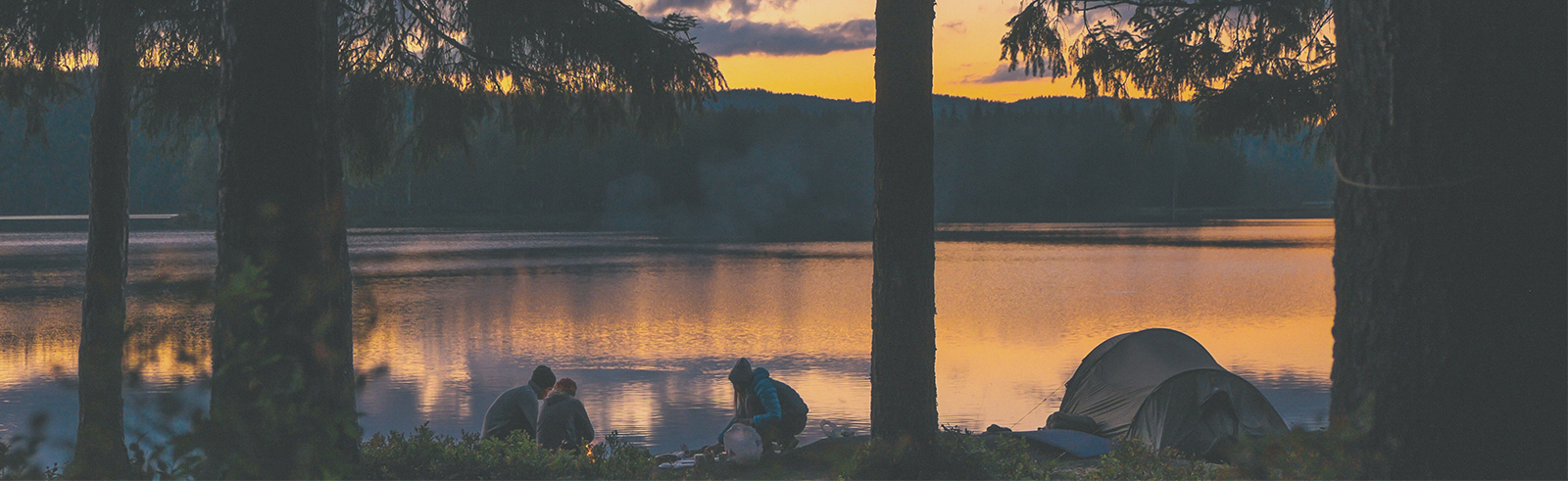 three student camping with tent near lake under moonlight